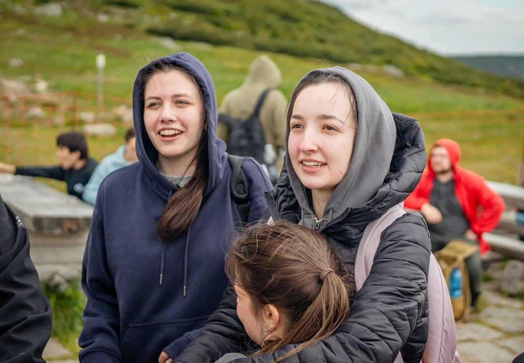 group of friends hugging outdoors